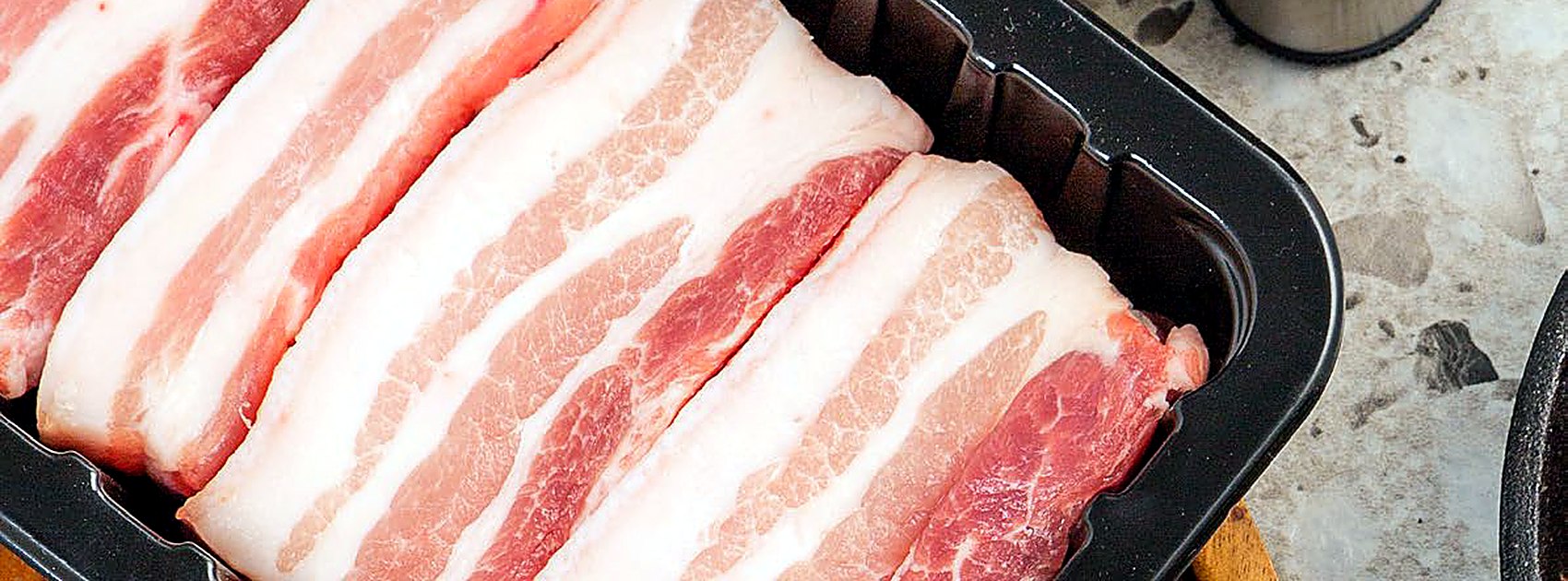 Retail meat packed in black PET trays