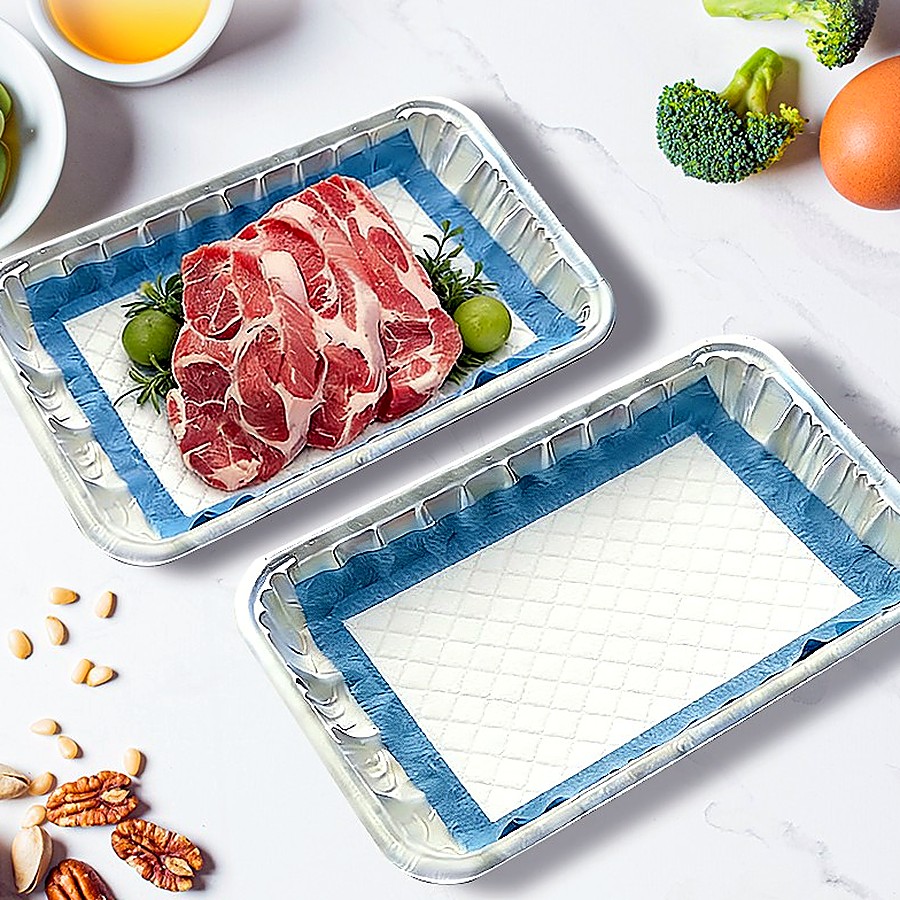 Absorbent soaker pad in retail meat trays